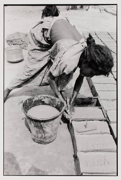 Forming bricks, India