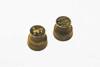 Two gold cast dies of a five Dinar coin made after the Islamic State currency proposal in 2014.…