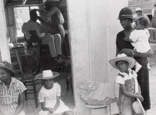 Negroes Gather Outside a Negro Store and Barbershop on Sat. Afternoon