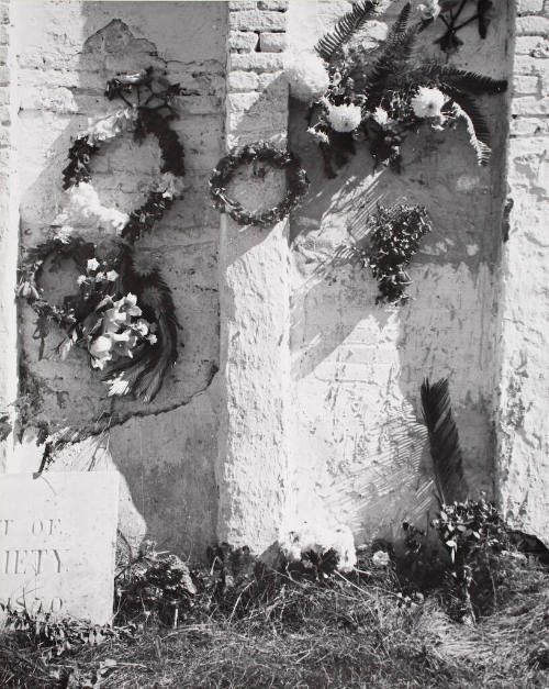 Decorations on the side of a family burial vault on All Saints Day, New Roads,..