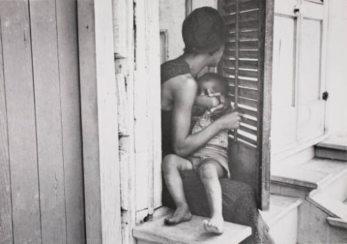 Negro Woman with a Child in a Doorway New Orleans, La.