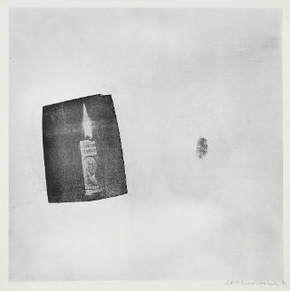 A black rectangular space with a lit candle wrapped in a paper resembling currency on the left;…