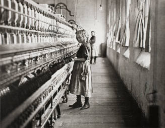 Young spinner in a Carolina Cotton Mill
