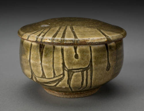 Olive green glazed ceramic jar with lid, featuring dark vertical line designs.